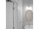 Bathroom with a gold framed oval mirror and a white vanity at 2393 Strand Ave, Lawrenceville, GA 30043