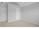 Bedroom featuring neutral walls, white trim, carpet and two doors at 2393 Strand Ave, Lawrenceville, GA 30043