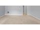 Bedroom with a neutral carpet and a doorway to other rooms at 2393 Strand Ave, Lawrenceville, GA 30043