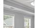 Bright bedroom showcasing natural light through windows with white trim at 2393 Strand Ave, Lawrenceville, GA 30043