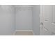 A walk-in closet with shelving and a white door at 2393 Strand Ave, Lawrenceville, GA 30043