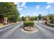 Gated community entrance with well maintained landscaping at 2393 Strand Ave, Lawrenceville, GA 30043