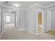 Hallway leading to a bathroom and multiple rooms at 2393 Strand Ave, Lawrenceville, GA 30043
