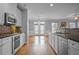 Bright kitchen featuring stainless steel appliances, granite countertops, and hardwood flooring at 2393 Strand Ave, Lawrenceville, GA 30043