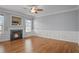 Bright living room with fireplace, hardwood floors, and decorative trim at 2393 Strand Ave, Lawrenceville, GA 30043