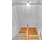 Staircase with a wooden handrail with combined carpeted and hardwood steps at 2393 Strand Ave, Lawrenceville, GA 30043