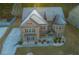 Beautiful aerial view of a 2-story brick home with manicured landscaping at 3070 Staglin Dr, Powder Springs, GA 30127