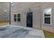 Back exterior view of house with window and door that leads to a patio at 3070 Staglin Dr, Powder Springs, GA 30127