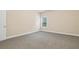 Neutral bedroom with cozy carpet, a single window, and white trim at 3070 Staglin Dr, Powder Springs, GA 30127