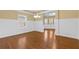 Elegant dining room with wainscoting, wood floors, and natural light, perfect for entertaining at 3070 Staglin Dr, Powder Springs, GA 30127