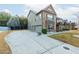 Two-story home with brick and siding, multi-car garage, and long driveway at 3070 Staglin Dr, Powder Springs, GA 30127