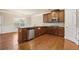 Well-lit kitchen features granite countertops, stainless steel appliances, and hardwood floors at 3070 Staglin Dr, Powder Springs, GA 30127