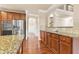 Spacious kitchen with stainless steel appliances, hardwood flooring, and a granite countertop at 3070 Staglin Dr, Powder Springs, GA 30127