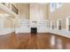 Open living room with fireplace, built-in shelving, and lots of natural light at 3070 Staglin Dr, Powder Springs, GA 30127