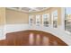 Bright living room with coffered ceilings, white trim, and large windows with wood floors at 3070 Staglin Dr, Powder Springs, GA 30127