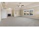 Spacious main bedroom with a fireplace, ceiling fan, and large windows providing lots of natural light at 3070 Staglin Dr, Powder Springs, GA 30127