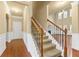 Welcoming foyer with staircase featuring decorative wrought iron spindles and wood railing at 3070 Staglin Dr, Powder Springs, GA 30127