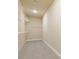 Walk-in closet featuring neutral carpeting and wire shelving for easy storage at 3070 Staglin Dr, Powder Springs, GA 30127