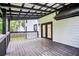 Large back deck with a covered patio, perfect for outdoor entertaining at 3481 Oak Run Dr, Lithonia, GA 30038