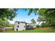 Beautiful backyard featuring a two-story home with a walkout deck and fenced yard offering shade at 3481 Oak Run Dr, Lithonia, GA 30038