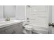 Bathroom with a shower-tub, gray vanity and modern fixtures at 3481 Oak Run Dr, Lithonia, GA 30038