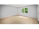 Bedroom with a window, wood floors and neutral paint at 3481 Oak Run Dr, Lithonia, GA 30038