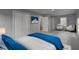 Bright bedroom with a blue accent blanket, light wood floors and plenty of seating at 3481 Oak Run Dr, Lithonia, GA 30038