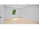Bedroom with light wood floors, a window with a view and neutral paint at 3481 Oak Run Dr, Lithonia, GA 30038