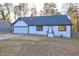 Charming one-story home featuring a freshly painted exterior, attached garage, and inviting front entrance at 3481 Oak Run Dr, Lithonia, GA 30038