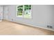 Well-lit living room showcasing hardwood floors and a large window at 3481 Oak Run Dr, Lithonia, GA 30038