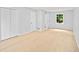 Large room with bright wood floors and three closets at 3481 Oak Run Dr, Lithonia, GA 30038