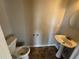 Small half bathroom featuring a pedestal sink and tile flooring, a common feature for the home's guests at 870 Pine Shoals Dr, Atlanta, GA 30349