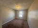 A standard bedroom with neutral walls, carpet flooring, and a single window offering natural light at 870 Pine Shoals Dr, Atlanta, GA 30349