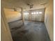 Spacious two-car garage offering ample parking and storage space, with two garage doors and a concrete floor at 870 Pine Shoals Dr, Atlanta, GA 30349