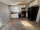 Cozy kitchen featuring modern appliances, white cabinets, a dual basin sink, and laminate floors at 870 Pine Shoals Dr, Atlanta, GA 30349