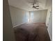 A spacious main bedroom illuminated by natural light and featuring a ceiling fan at 870 Pine Shoals Dr, Atlanta, GA 30349