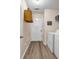 Efficient laundry room with washer, dryer, and ample storage for convenience at 2327 Maple Ave, Morrow, GA 30260