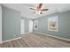 Large bedroom with vinyl floors and two windows at 2494 Baxter Rd, Atlanta, GA 30315