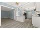 A modern kitchen featuring white cabinets, stainless steel appliances, and stylish pendant lighting at 2494 Baxter Rd, Atlanta, GA 30315