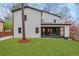Exterior of home with expansive backyard and covered patio at 2497 Wawona Ne Dr, Brookhaven, GA 30319