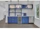 Close up of bar area featuring custom shelving, beverage cooler, and stainless steel dishwasher at 2497 Wawona Ne Dr, Brookhaven, GA 30319