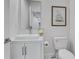 Modern bathroom with vessel sink, white cabinetry, and contemporary fixtures at 2497 Wawona Ne Dr, Brookhaven, GA 30319