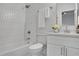 Bathroom with white subway tile, shower-tub combo, and traditional vanity at 2497 Wawona Ne Dr, Brookhaven, GA 30319