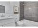 Elegant bathroom with a modern vanity, bathtub, shower with tiled walls, and artistic decor at 2497 Wawona Ne Dr, Brookhaven, GA 30319