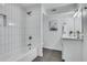 Bright bathroom featuring a bathtub with vertical subway tile and modern vanity at 2497 Wawona Ne Dr, Brookhaven, GA 30319