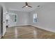 Spacious bedroom with hardwood floors, natural light, and a walk-in closet, providing ample storage space at 2497 Wawona Ne Dr, Brookhaven, GA 30319