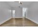 Bedroom view showcasing hardwood floors, ceiling fan, and connections to an ensuite bathroom and walk-in closet at 2497 Wawona Ne Dr, Brookhaven, GA 30319