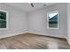 Sunny bedroom with hardwood floors and natural light from two windows at 2497 Wawona Ne Dr, Brookhaven, GA 30319