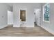 Bright bedroom showcasing hardwood floors, neutral walls, and an ensuite bathroom featuring modern fixtures and finishes at 2497 Wawona Ne Dr, Brookhaven, GA 30319