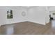 Bright bedroom featuring hardwood floors, white walls, and large window with natural light at 2497 Wawona Ne Dr, Brookhaven, GA 30319